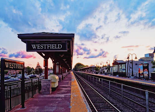 A train station named Westfield with a train on the tracks.at The Franklin at Westfield, New Jersey, 07090