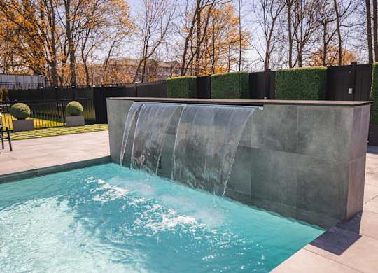 the pool with a water feature with a waterfall at The Franklin at Westfield, Westfield, NJ 07090