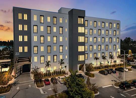 a rendering of a hotel at dusk with the lights on in the windows at Elements on Third Apartments, St. Petersburg, FL, 33713