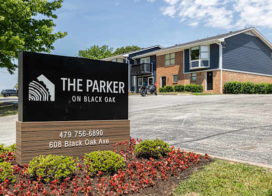 The Parker on Black Oak sign in front of a building.