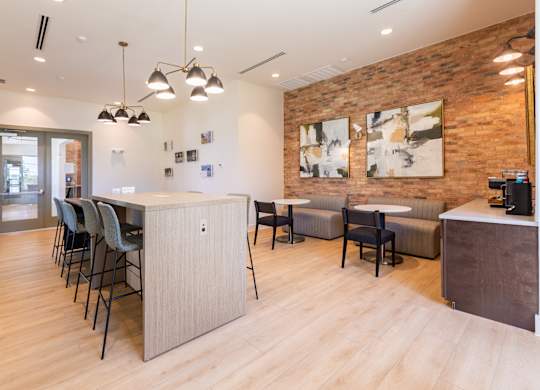 A modern office space with a long table and chairs.