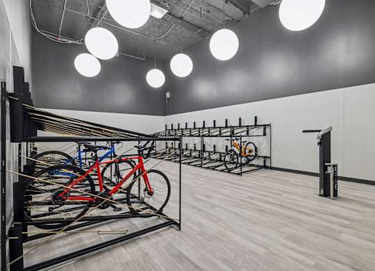 A room with a bicycle parking area and a white wall at LiveWell Apartments, Pennsylvania