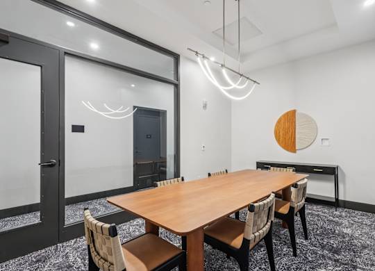 A conference room with a long table and chairs. at LiveWell Apartments, Pittsburgh