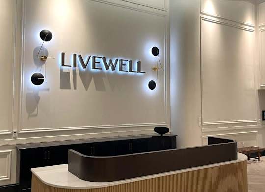 A reception area with a Livewell sign on the wall.