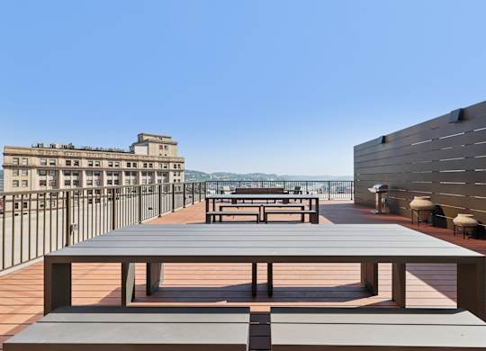 A long wooden table is in the middle of a patio at LiveWell Apartments, Pennsylvania