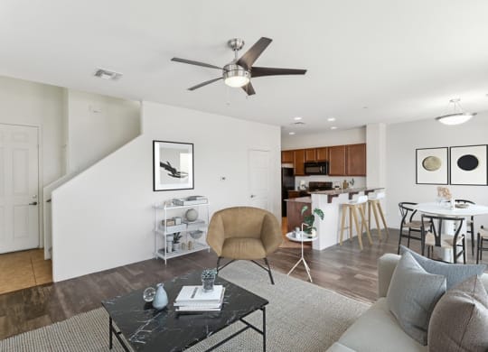 a living room with a couch and a ceiling fan at Galeria Del Rio, Tucson