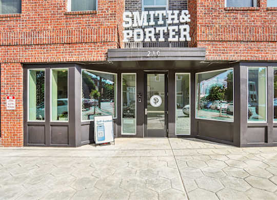 The front of a brick building with the name