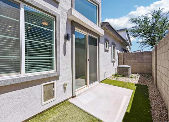Baseline on 16th townhome with a glass door and a small patio.