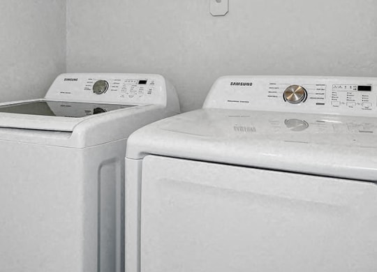 two white washing machines in a white laundry room at Baseline on 16, Arizona