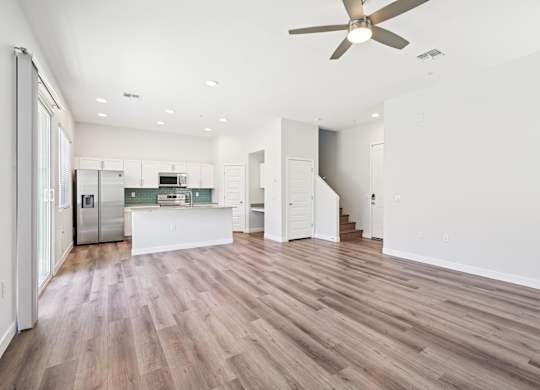 Baseline on 16th townhome spacious kitchen with a refrigerator, microwave, and oven.