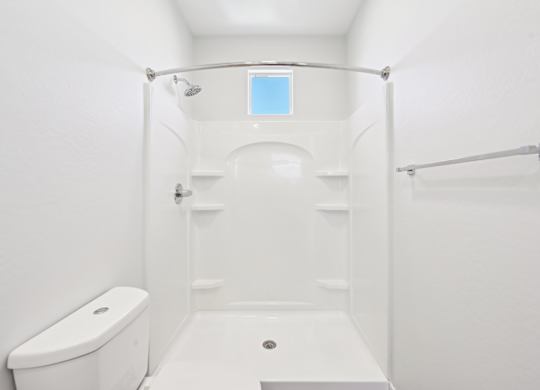 Baseline on 16th townhome bathroom with a toilet, a shower, and a bathtub.
