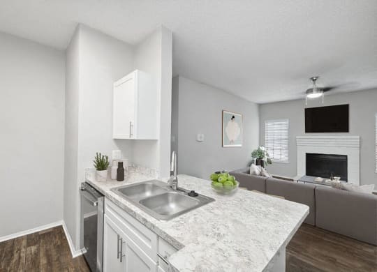 an open kitchen and living room with a sink at Heatherstone, Dallas