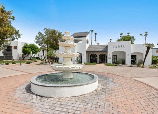 a fountain in front of a white building at Vertu, Phoenix, 85014