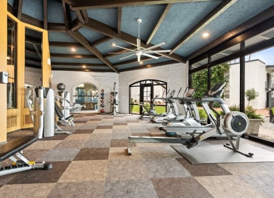 the gym has plenty of exercise equipment and a large window at Vertu, Phoenix, Arizona