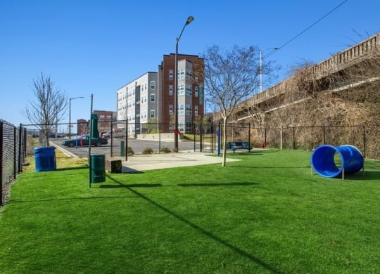 a playground in a park with a building in the background at Smith and Porter, Atlanta, 30313