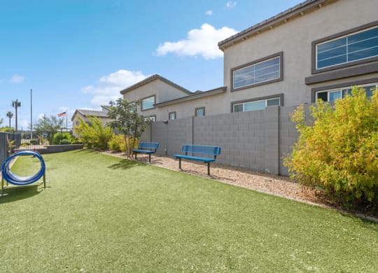 a yard with a playground and benches in front of a building at Baseline on 16, Phoenix