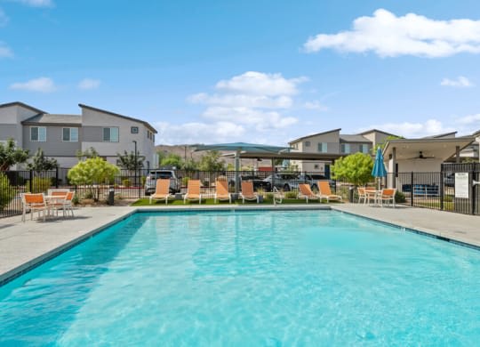 a large swimming pool with chairs around it at Baseline on 16, Phoenix, Arizona