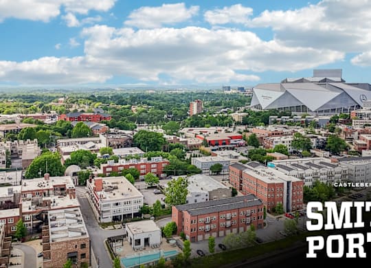 A cityscape with a stadium and the words