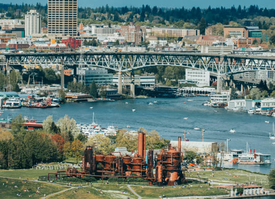 a view of a city with a bridge and a river