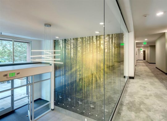 a long hallway with a large glass shower