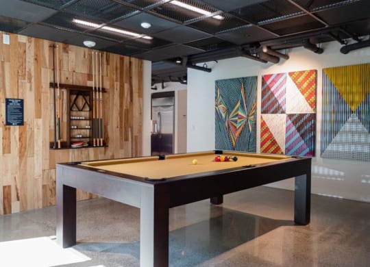 a billiards table in the lobby of an art gallery