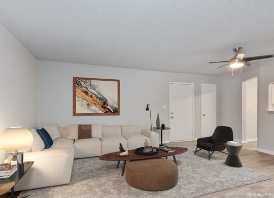 a living room with a white couch and a coffee table  at Eastwood Crossings, Kansas City, Missouri
