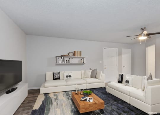 a living room with two white couches and a coffee table  at Eastwood Crossings, Missouri