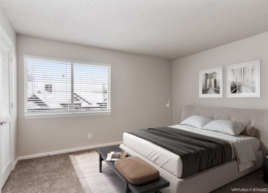 a bedroom with a bed and a window  at Eastwood Crossings, Kansas City, 64129