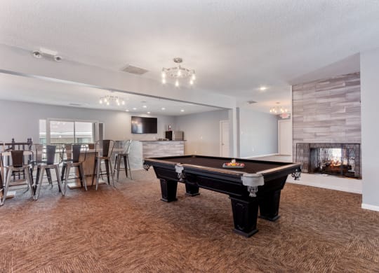 the preserve at ballantyne commons clubhouse with pool table and fireplace at Eastwood Crossings, Kansas City
