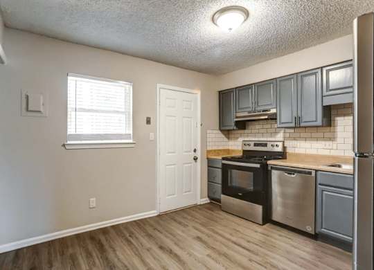 Kitchen and living room with lights at Greenwood Village, Charlotte