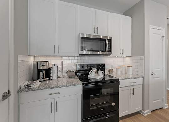 Modern Kitchen With White Cabinet at Citadel at Westpointe Apartments, San Antonio, TX, 78245