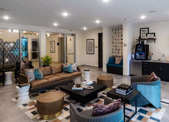 A living room with a brown couch, a coffee table at Hudson at Renaissance Apartments, Wilmington