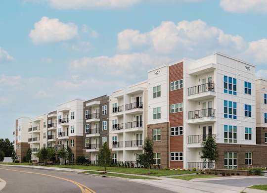 Apartment building with balconies and multiple stories at Hudson at Renaissance Apartments, Wilmington, North Carolina