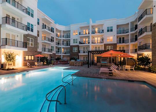 A large swimming pool in front of apartment buildings at Hudson at Renaissance Apartments, Wilmington, North Carolina