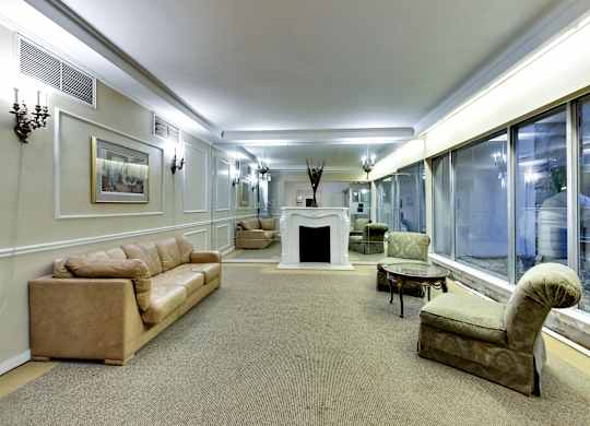 A living room with a fireplace and a couch.