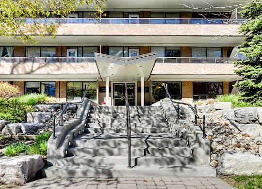 a building with a set of stairs and a fountain