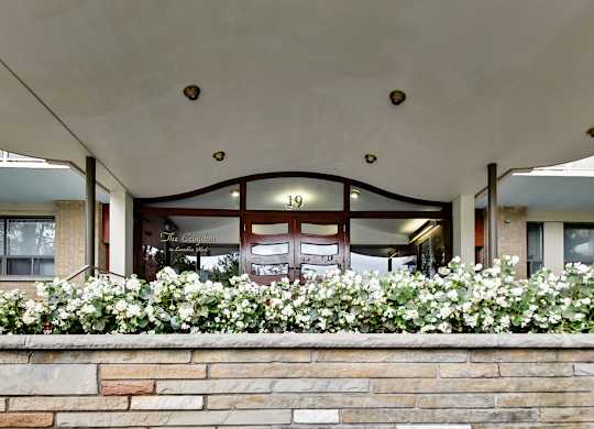 The entrance to a building with a sign that reads