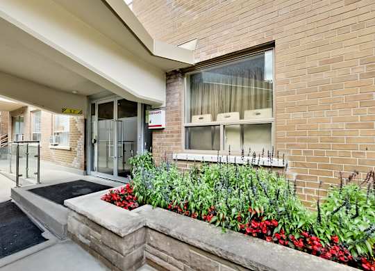 the preserve at cardinal heights front entrance to a brick building with flowers and plants