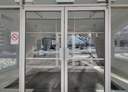 a glass door with a no smoking sign on it