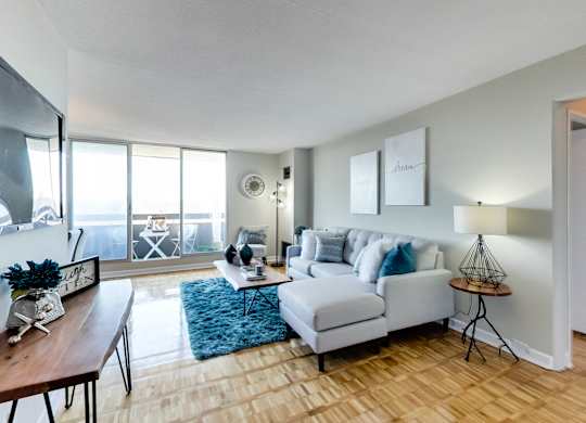 a living room with a couch and a chair and a table