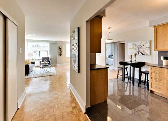 a view from the living room into the kitchen and dining room of a house