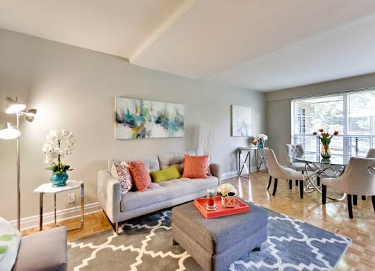 a living room with a couch and a dining room table