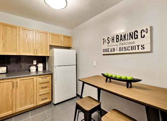 A kitchen with a sign that says