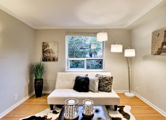 a living room with a couch and a window