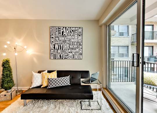 a living room with a couch and a large window