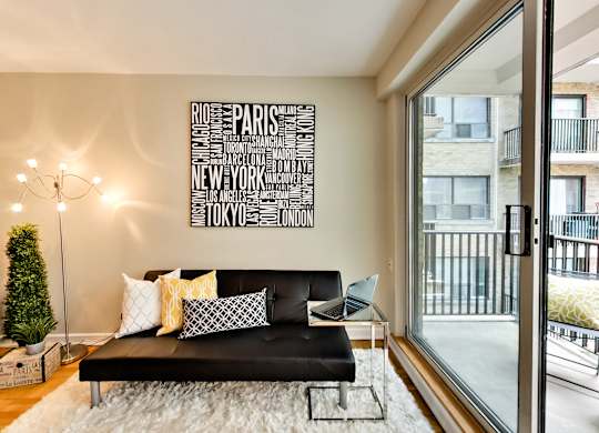 a living room with a couch and a large window