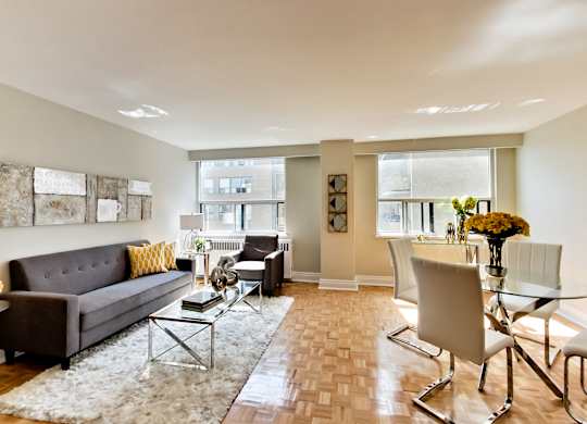 a living room and dining room with a couch and a table