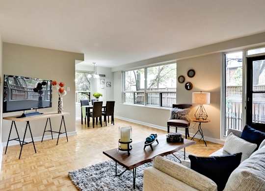 a living room with a couch and a coffee table and a television