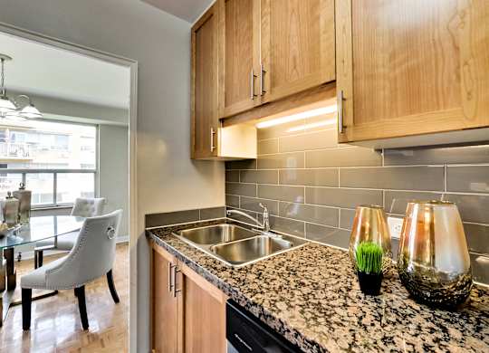 a kitchen with granite counter tops and a sink