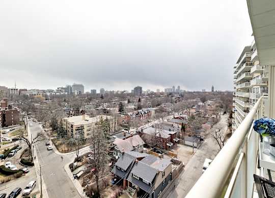 A view from a high-rise building looking down at a city street.